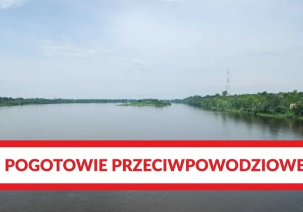 Rzeka z zielonymi brzegami i wyspą pośrodku, na dole czerwono-biały baner z napisem Pogotowie przeciwpowodziowe.