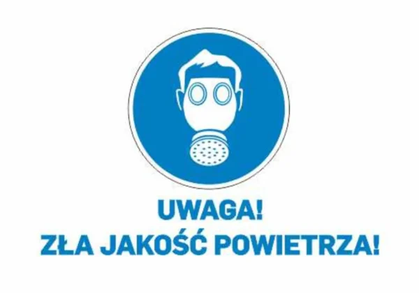 Ikona ostrzegawcza przedstawiająca maskę gazową w niebieskim kole z napisem „Uwaga! Zła jakość powietrza!”