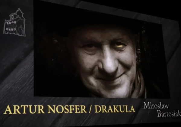 Promocyjny plakat filmu NOSFERARTUR z zbliżeniem twarzy wampira o bladej cerze na ciemnym tle.